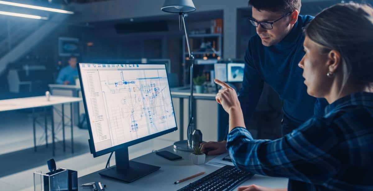 Two people looking at a computer screen